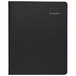 An At-A-Glance black appointment book with gold text.