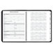 A black At-A-Glance notebook with a spiral-bound calendar inside.