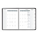 A black At-A-Glance Triple View weekly/monthly appointment book calendar with white pages and spiral binding.