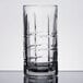 A close-up of an Anchor Hocking Tartan Iced Tea Glass with a checkered pattern.