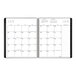 An At-A-Glance monthly planner with a calendar page.