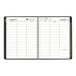 An At-A-Glance black and green spiral bound planner with a calendar.