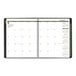 A black At-A-Glance recycled monthly planner with green and white calendar pages and numbers.