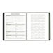 A black spiral bound At-A-Glance monthly planner with calendar pages.