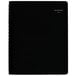 A black notebook with a spiral bound cover and white text.