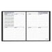 A black spiral bound At-A-Glance calendar with open schedule pages.