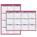 An At-A-Glance wall planner with a blue and red border and white background with a few months and dates.