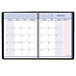 A white spiral-bound calendar page with black and pink writing and accents.