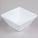 A white square Elite Global Solutions melamine bowl.