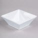 a white square bowl with a corner