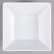 A white square bowl on a gray surface.