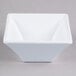 A white square Elite Global Solutions melamine bowl.
