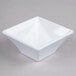 A white square Elite Global Solutions melamine bowl.