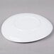 A white Elite Global Solutions melamine plate with a swirl pattern.