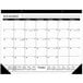 A white At-A-Glance desk pad calendar with black numbers and days of the week.