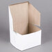 A white cake box with an open lid.