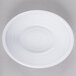 a white plate with a circular pattern