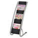An Alba silver and black magazine rack displayed with magazines.