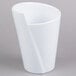 A white crock with a curved edge.