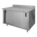 A stainless steel Advance Tabco work table with cabinet base.