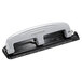 A close-up of a black and silver Bostitch PaperPro 3 hole punch with metal accents.