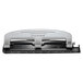 A close-up of a Bostitch PaperPro silver and black hole punch with metal holes.
