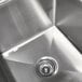 A stainless steel Advance Tabco pot sink with one drainboard on the right.