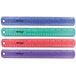 A row of colorful Westcott plastic rulers with black lines on a white background.