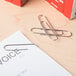 A piece of paper with Acco paper clips on it.