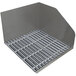 A stainless steel mop sink with a fiberglass grate on top.