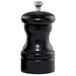 A black pepper mill with a silver knob.