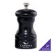 A black Chef Specialties Capstan ebony pepper mill on a counter.