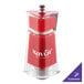 A red and clear Chef Specialties Kate pepper mill with the word "Savor" on it.