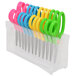 A group of Westcott kids scissors in a plastic case with yellow and green, blue and yellow, and pink and blue handles.