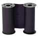 A close-up of two rolls of black film with two holes.
