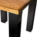 A rectangular wooden bar table with a black BFM Seating I-Beam table base.