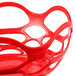 A red plastic basket with an open weave design.