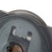 A close up of the Westcott titanium rotary paper trimmer straight blade, a circular metal object with a hole in it.