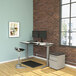 A desk with an Alera black heavy-duty Articulating Dual Monitor Arm with USB and Audio Ports holding two computer monitors.