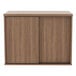 A brown wooden Alera low storage cabinet with sliding doors.