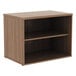 An Alera walnut low storage cabinet with shelves.