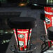 A group of Holland Bar Stool University of Georgia LED bar stools with a bulldog logo on them on an outdoor patio.