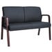 A black leather Alera reception loveseat with mahogany wooden legs.