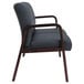 A black leather Alera reception loveseat with wooden legs.