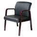 A black leather chair with wooden legs and armrests.