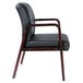 A black Alera reception arm chair with mahogany wood legs.