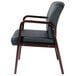 A black leather Alera reception chair with mahogany wood legs.