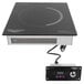 A black square Vollrath Mirage Series drop in induction warmer with a white cord.