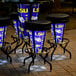 A group of Holland Bar Stools with Louisiana State University logos on them on an outdoor patio.