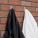 a black and white coat on hooks